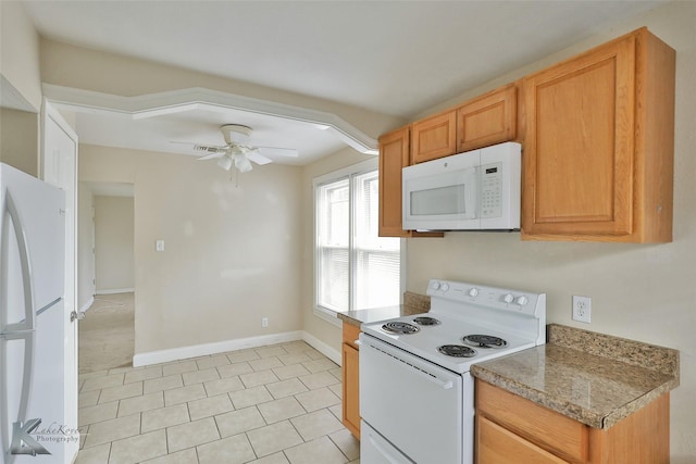 kitchen featuring white appliances, ceiling fan, baseboards, and light tile patterned floors