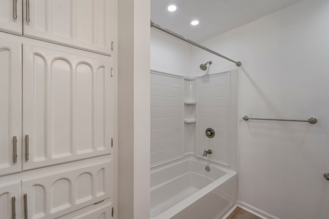 full bath featuring recessed lighting, baseboards, and bathing tub / shower combination