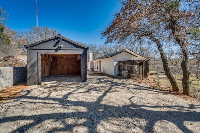 detached garage with fence