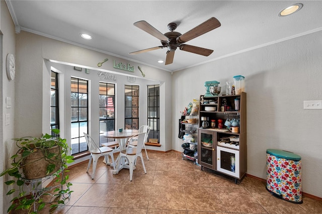 dining space featuring recessed lighting, a textured wall, ornamental molding, ceiling fan, and baseboards