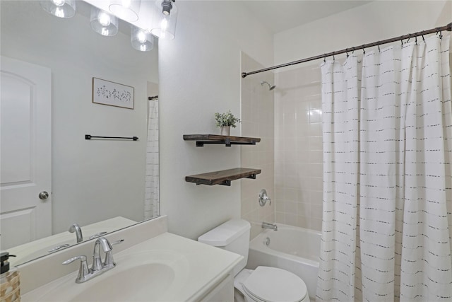 bathroom featuring vanity, shower / bath combination with curtain, and toilet