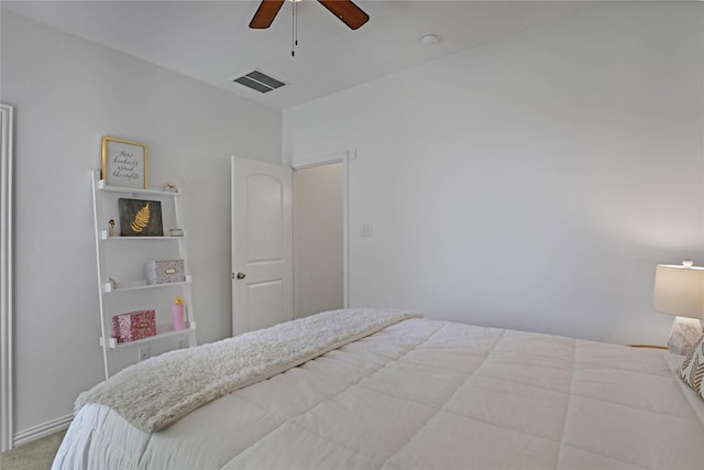 carpeted bedroom featuring visible vents and ceiling fan