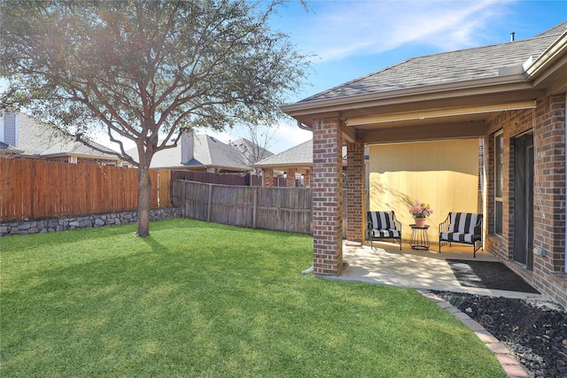 view of yard featuring a patio area and a fenced backyard