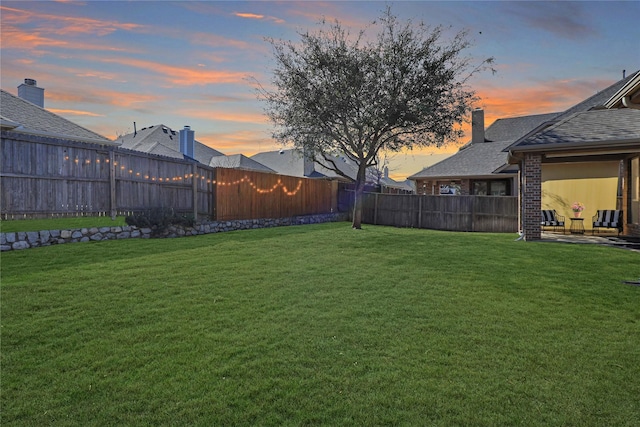 view of yard with a fenced backyard