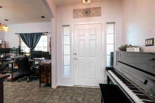 entryway featuring arched walkways