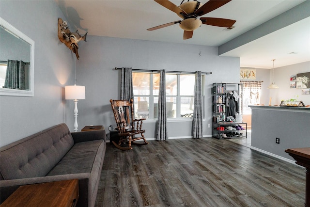 living area featuring ceiling fan, wood finished floors, visible vents, and baseboards