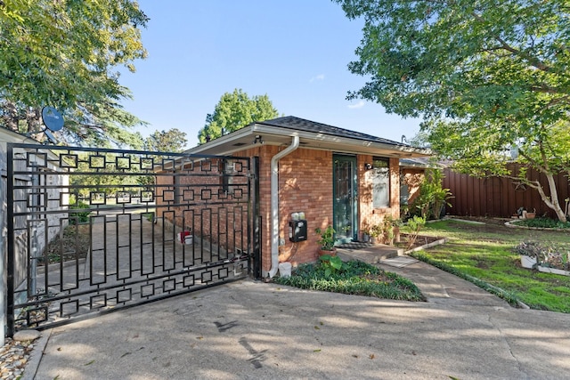 view of gate featuring fence