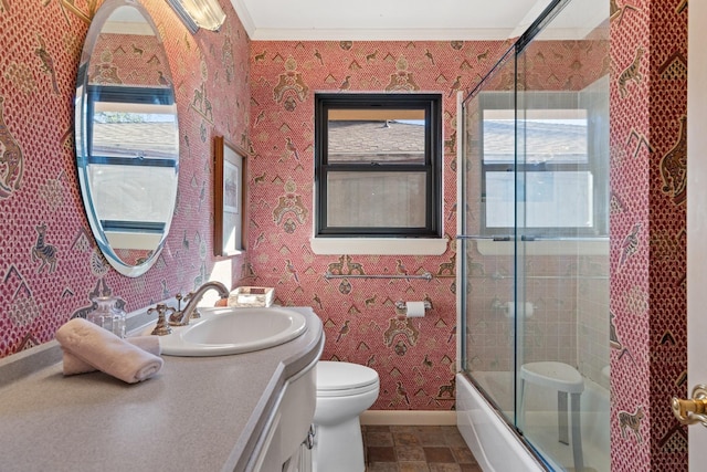 bathroom with baseboards, vanity, toilet, and wallpapered walls