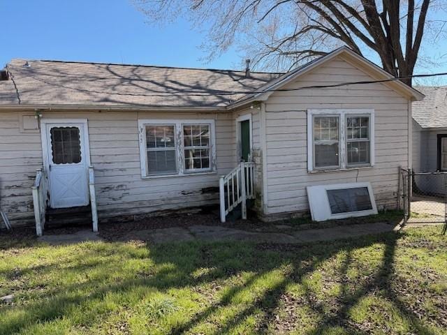 exterior space with a front yard and fence