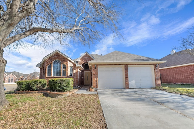 single story home featuring a garage, concrete driveway, brick siding, and a shingled roof