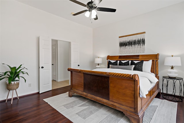 bedroom with ceiling fan, baseboards, and wood finished floors