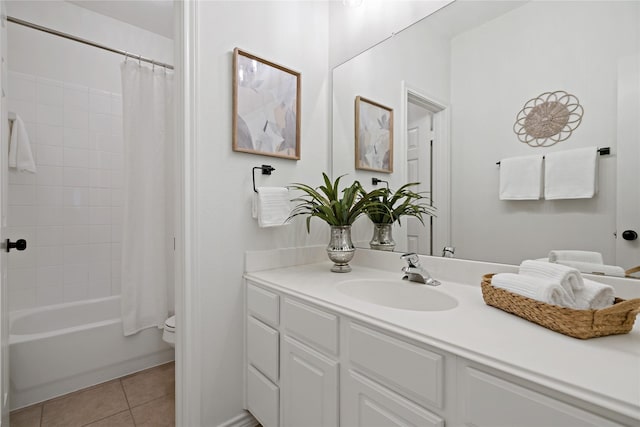 bathroom with shower / tub combo with curtain, vanity, toilet, and tile patterned floors