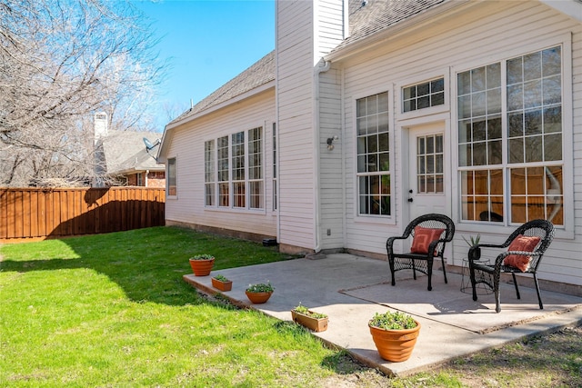 exterior space with a patio and fence