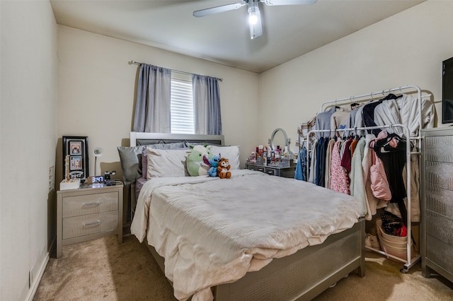 bedroom with carpet floors, a ceiling fan, and baseboards