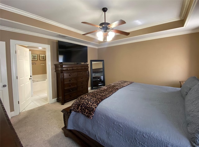 bedroom featuring a tray ceiling, carpet, ceiling fan, and crown molding