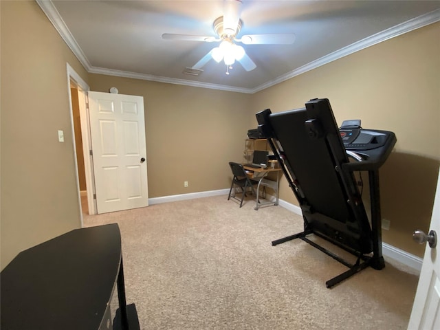 exercise room with crown molding, a ceiling fan, baseboards, and carpet floors