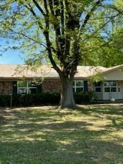 view of front of home with a front lawn