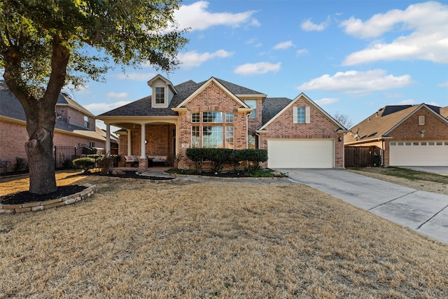 traditional-style house featuring brick siding, fence, and a front lawn