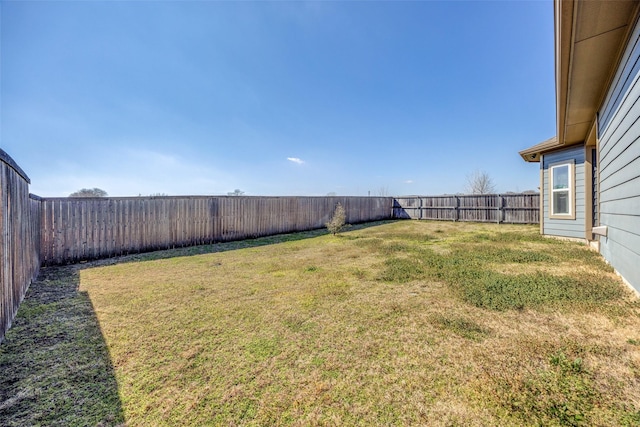 view of yard featuring a fenced backyard