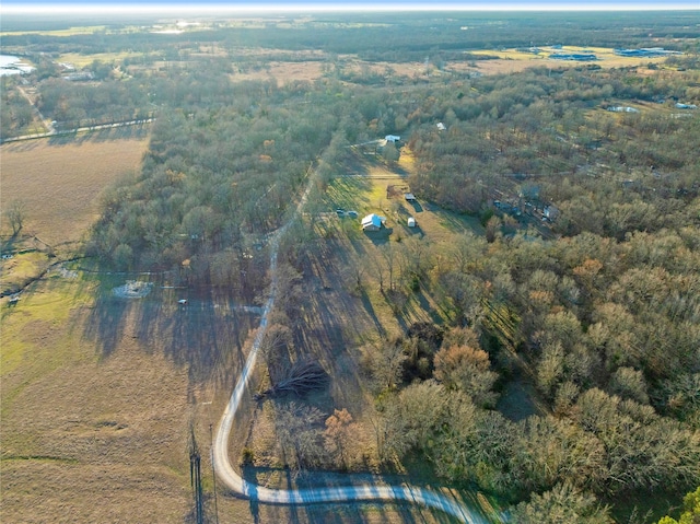 aerial view with a wooded view