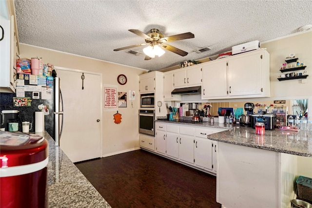 kitchen featuring visible vents, appliances with stainless steel finishes, a ceiling fan, white cabinets, and under cabinet range hood