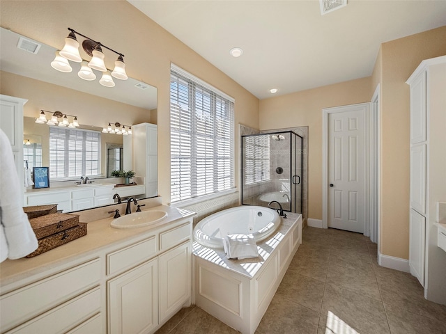 bathroom featuring visible vents, vanity, a shower stall, a whirlpool tub, and tile patterned floors