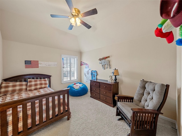 carpeted bedroom with a ceiling fan and lofted ceiling