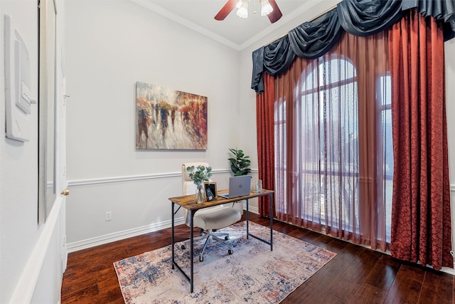 office area with ornamental molding, a ceiling fan, hardwood / wood-style floors, and baseboards