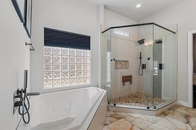 bathroom featuring marble finish floor, a tub with jets, a stall shower, and recessed lighting