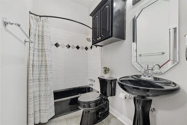 bathroom featuring shower / bath combination with curtain, toilet, and baseboards