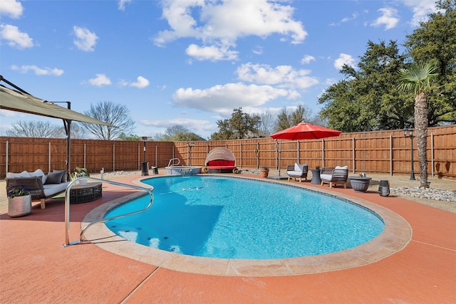 view of pool featuring a patio area, a fenced in pool, and a fenced backyard