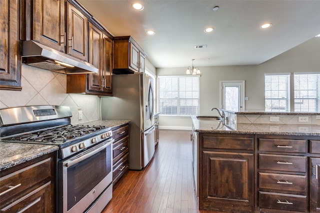 kitchen with recessed lighting, under cabinet range hood, visible vents, a sink, and appliances with stainless steel finishes