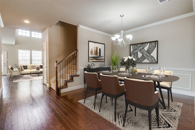 dining area featuring crown molding, an inviting chandelier, stairs, and dark wood finished floors