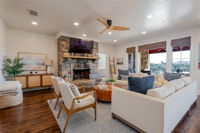 living room featuring visible vents, a ceiling fan, wood finished floors, a fireplace, and recessed lighting