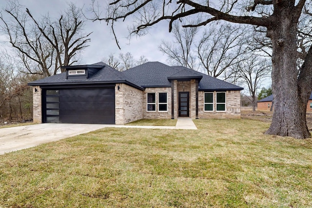 view of front of house with brick siding, roof with shingles, a front yard, a garage, and driveway