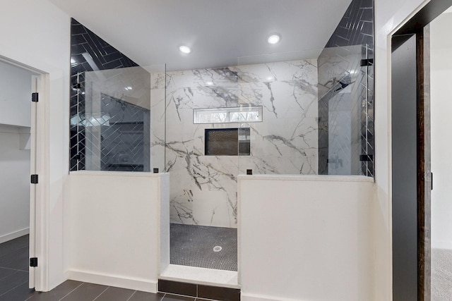 bathroom featuring a marble finish shower and recessed lighting