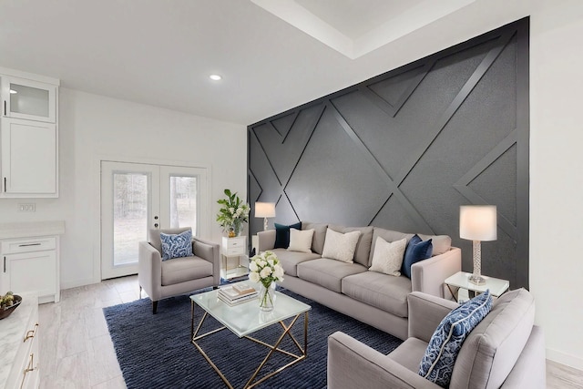 living room featuring light wood finished floors, recessed lighting, baseboards, and french doors