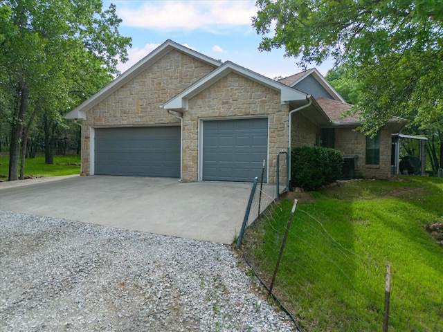 ranch-style house featuring a front lawn, driveway, a shingled roof, and an attached garage