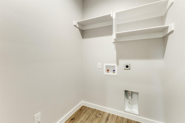 washroom with washer hookup, light wood-style floors, electric dryer hookup, laundry area, and baseboards