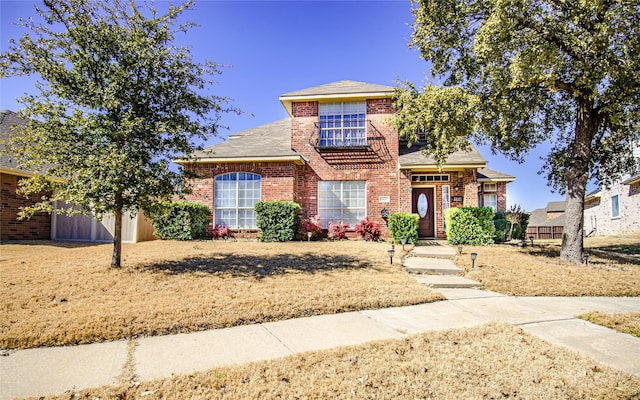 traditional-style home featuring brick siding