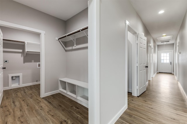 hall featuring attic access, recessed lighting, baseboards, and wood finished floors