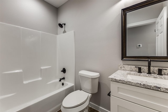 bathroom with baseboards, shower / tub combination, vanity, and toilet