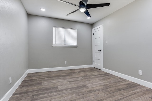 empty room featuring ceiling fan, recessed lighting, wood finished floors, and baseboards