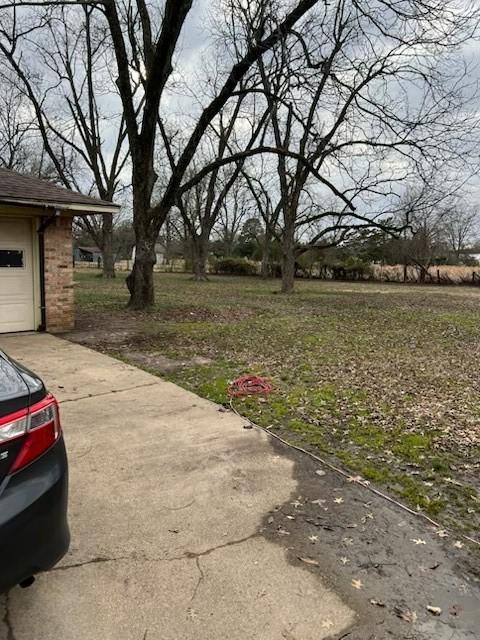 view of yard featuring a garage