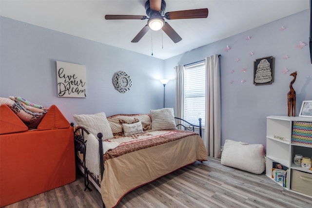 bedroom with wood finished floors and a ceiling fan