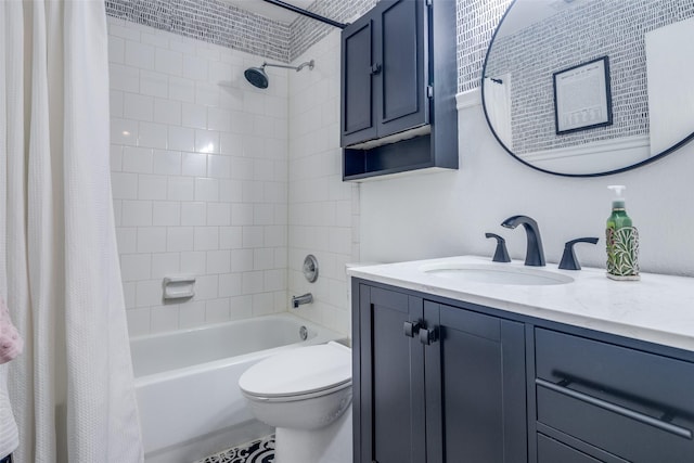 full bathroom with shower / tub combo with curtain, vanity, and toilet