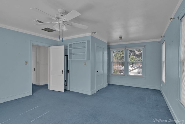 unfurnished bedroom featuring visible vents, ornamental molding, carpet flooring, ceiling fan, and baseboards