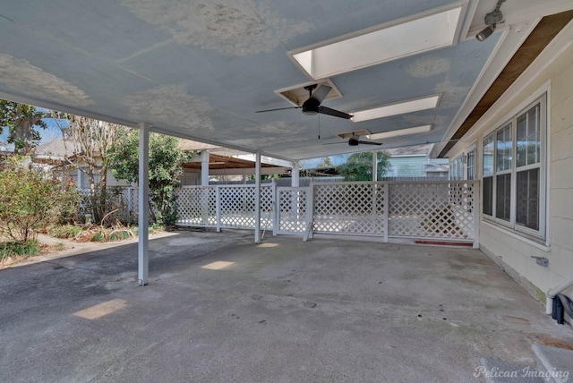 view of patio with ceiling fan and fence