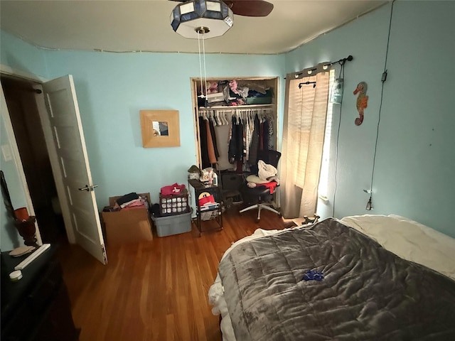 bedroom with a closet and wood finished floors