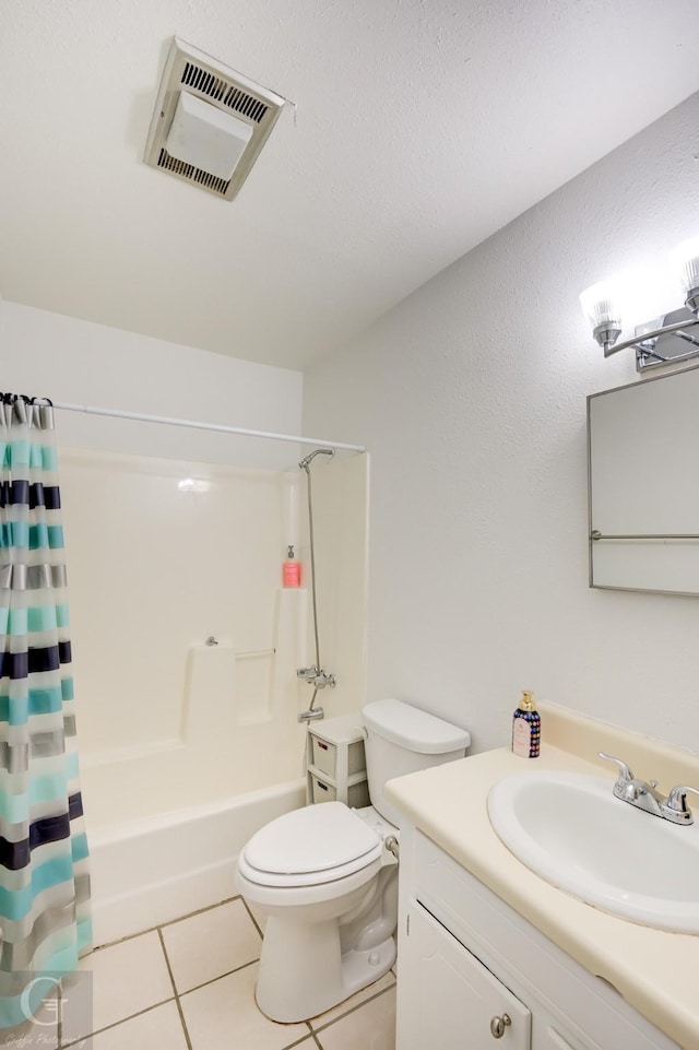 full bathroom with toilet, tile patterned floors, vanity, visible vents, and shower / tub combo with curtain